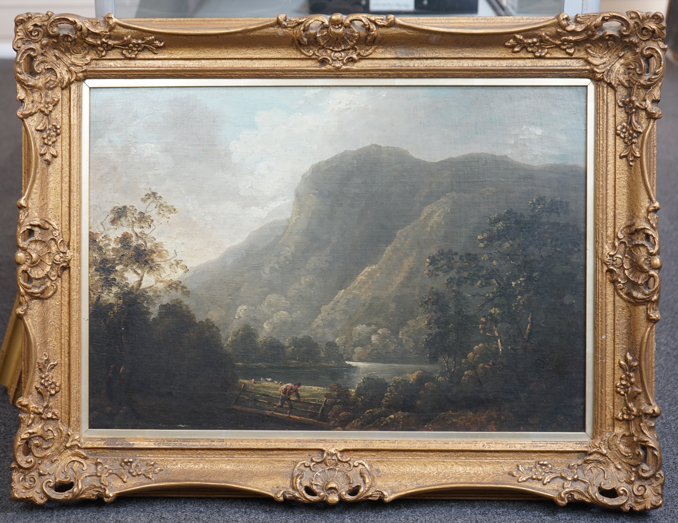 Attributed to Richard Wilson (English, 1714-1782), Mountainous scene with lake, tree and figures crossing a bridge, oil on canvas, 41 x 58cm